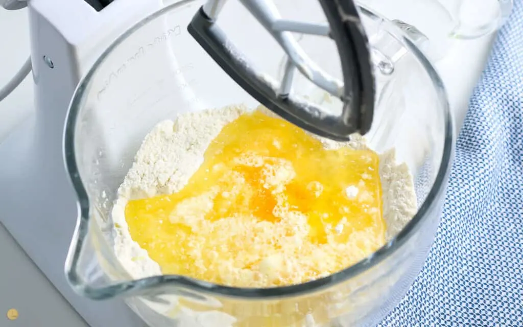 cake mix, eggs, and water in a mixing bowl