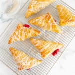 cherry turnovers on a wire rack