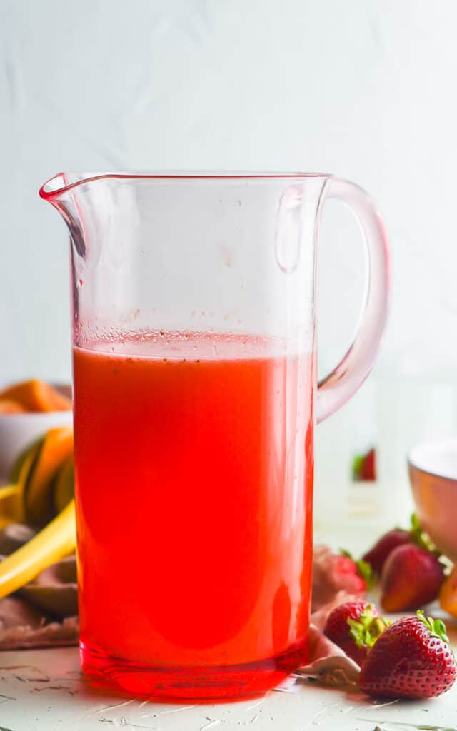 glass pitcher of strawberry lemonade