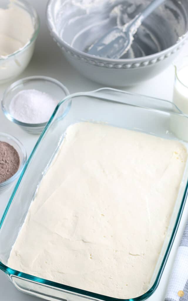 baking dish spread with cream cheese
