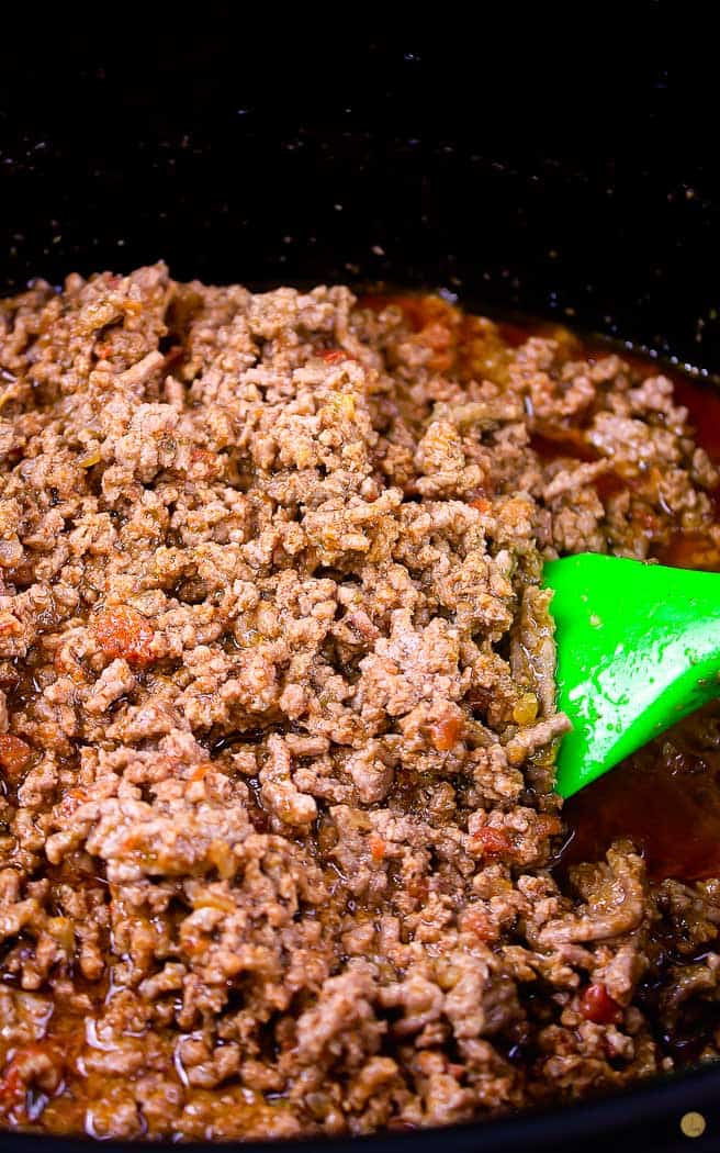 close up of cooked ground beef on a green spatula