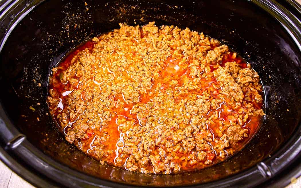 cooked taco meat in a crock pot bowl