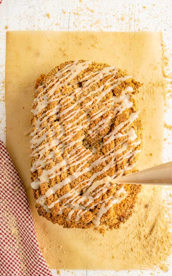 drizzle of glaze on streusel topped quick bread