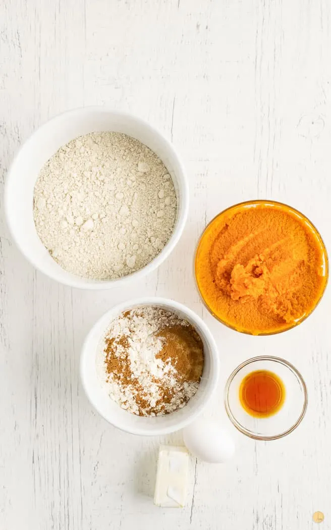 ingredients for pumpkin bread on white background