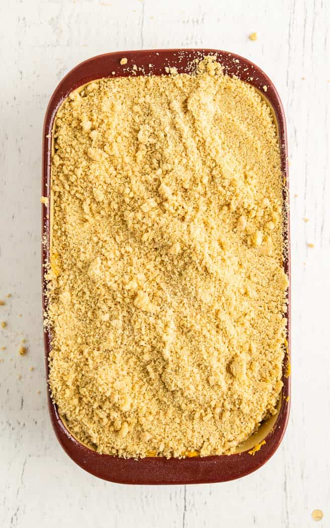 loaf of quick bread with streusel topping in a loaf pan