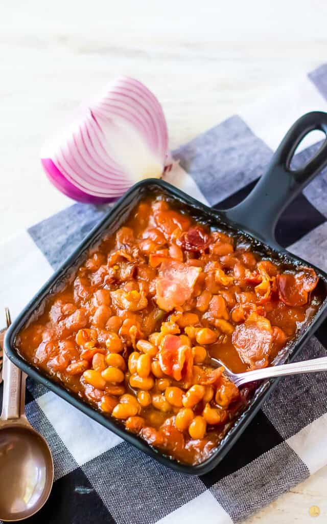 side angle of beans in a cast iron square pan