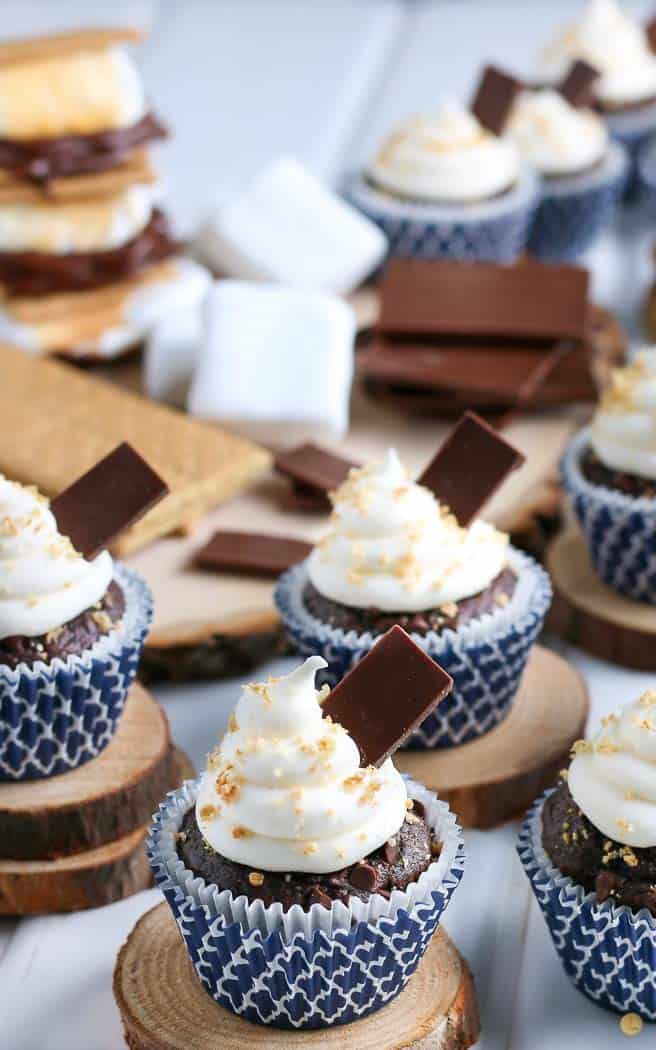 close up of smores cupcakes on wood boards