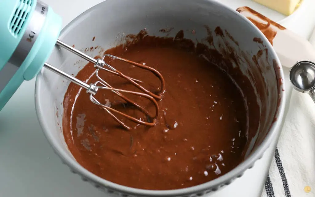 cupcake batter with whisk in a bowl