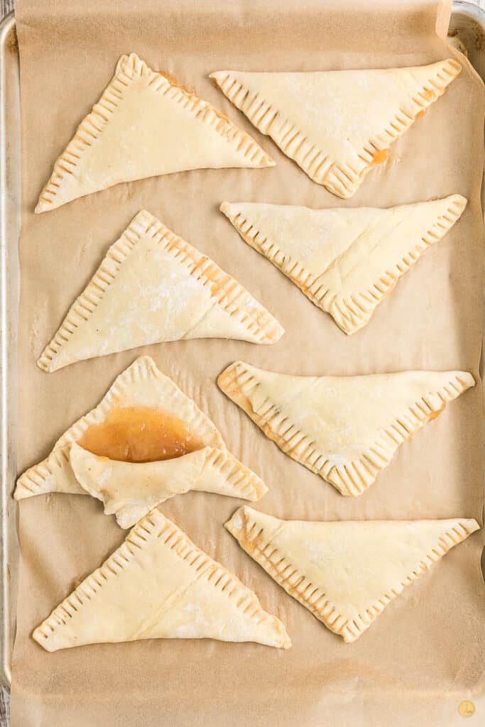puff pastry triangles on parchment paper