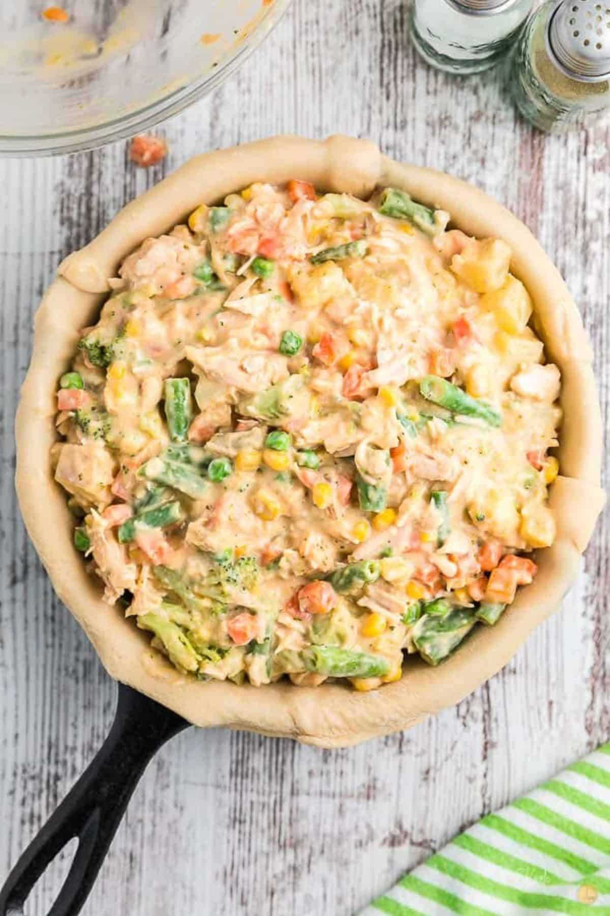 filling ingredients in a pie crust