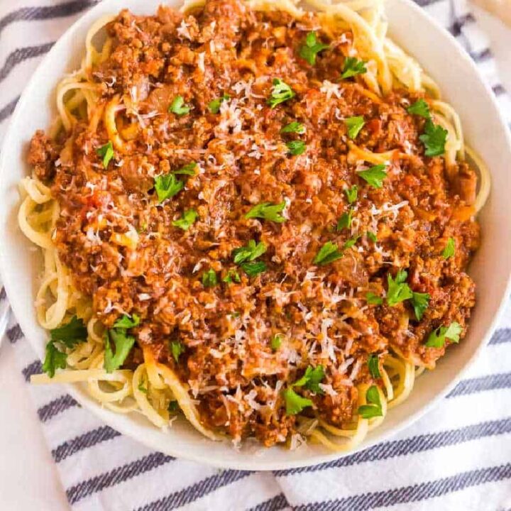square picture of bowl of spaghetti and meat sauce