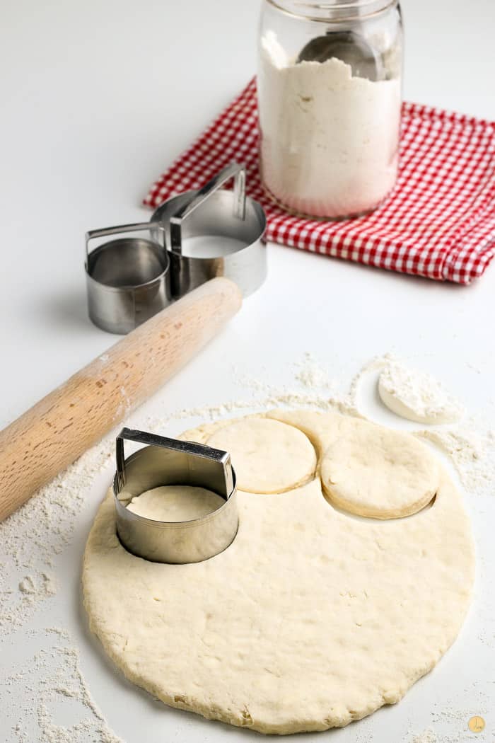 biscuits being cut out of dough