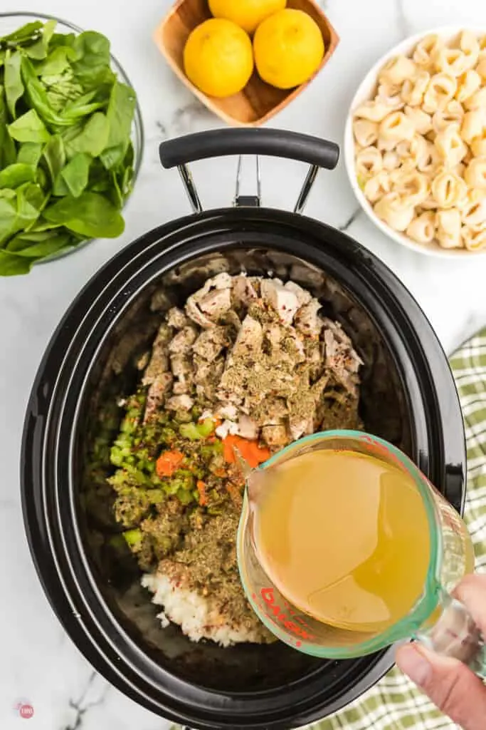 broth pouring into slow cooker