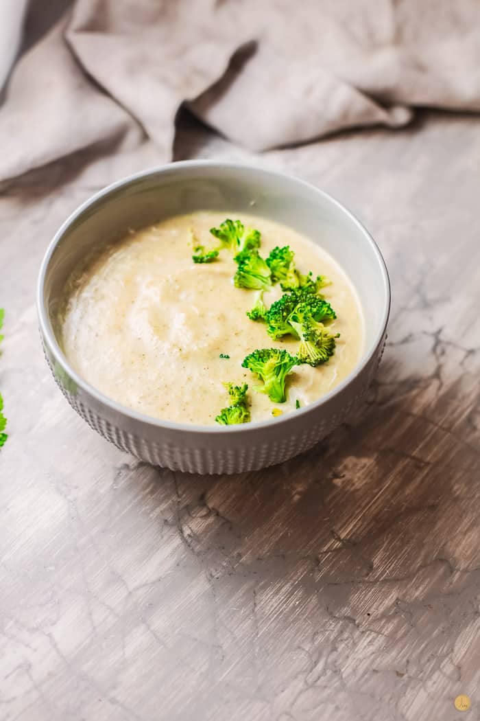 broccoli soup in a grey bowl