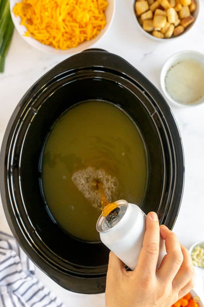 beer pouring into crockpot