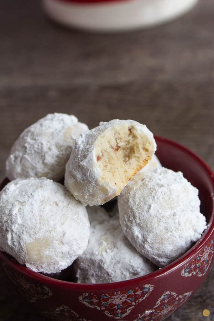 red bowl of pecan snowball cookies