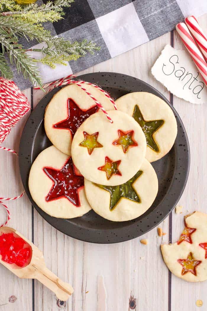 stained glass cookies on a black plate