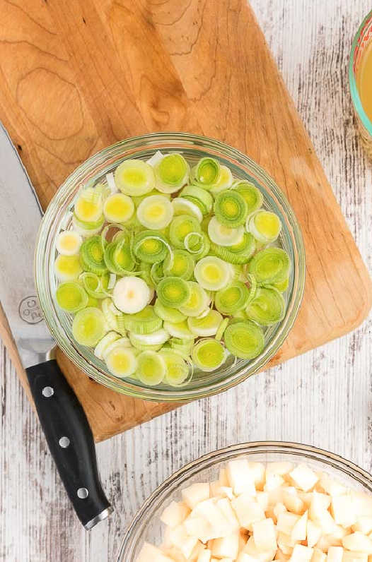 leeks in a bowl of water