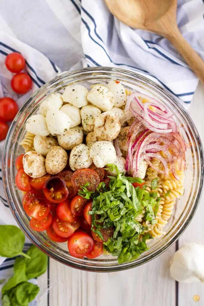 caprese pasta salad in a bowl unmixed