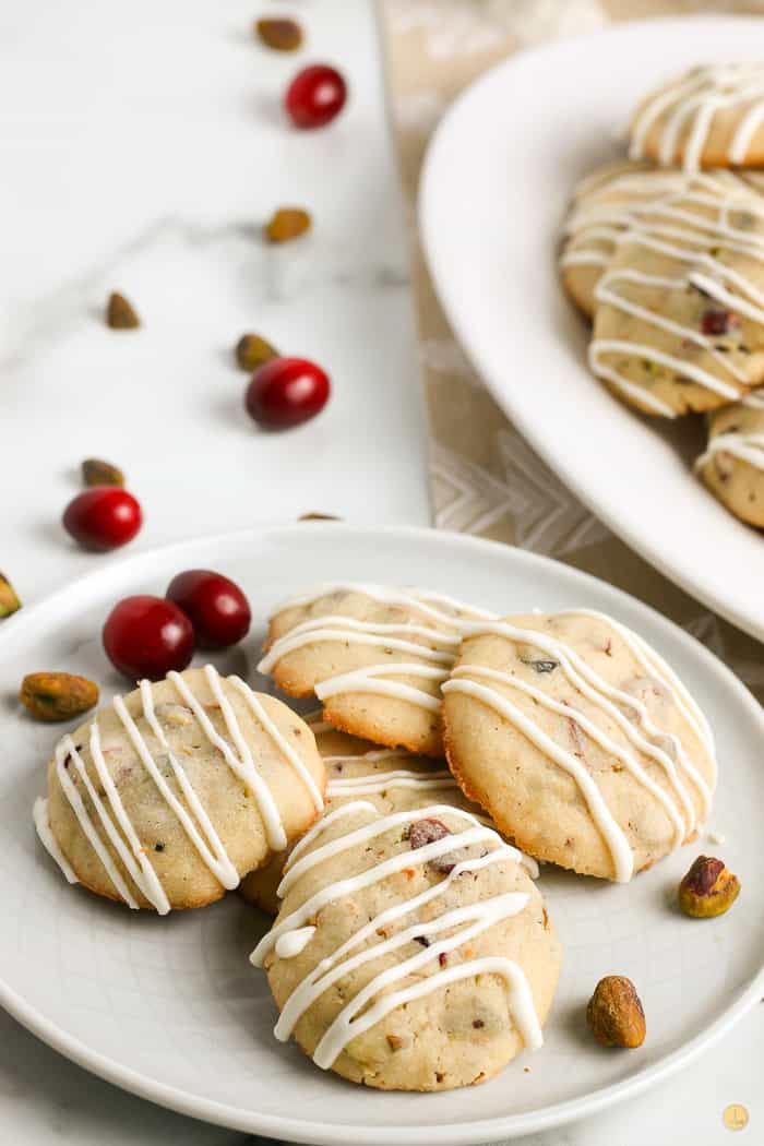 cranberry pistachio cookies on a grey plate