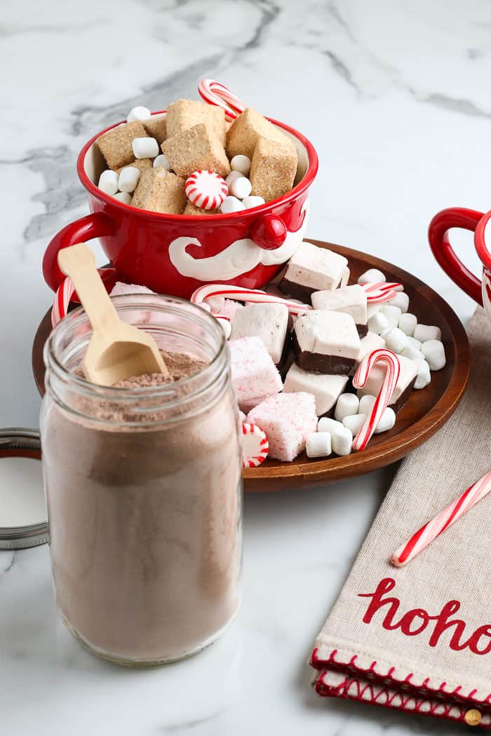 jar of cocoa mix with tray of toppings