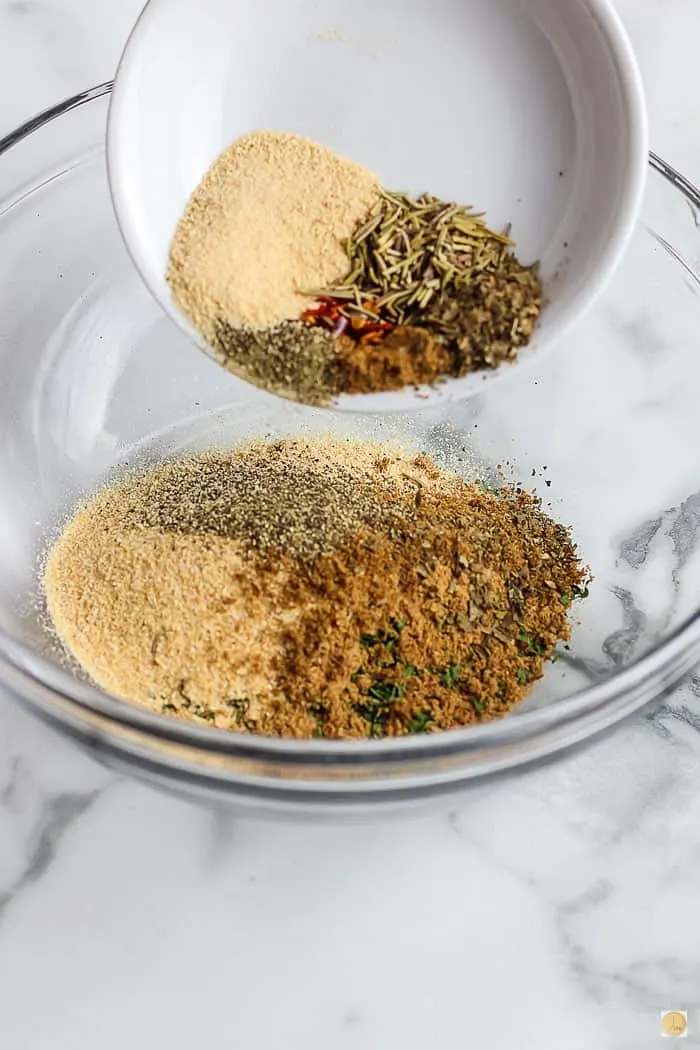 spices pouring into a bowl