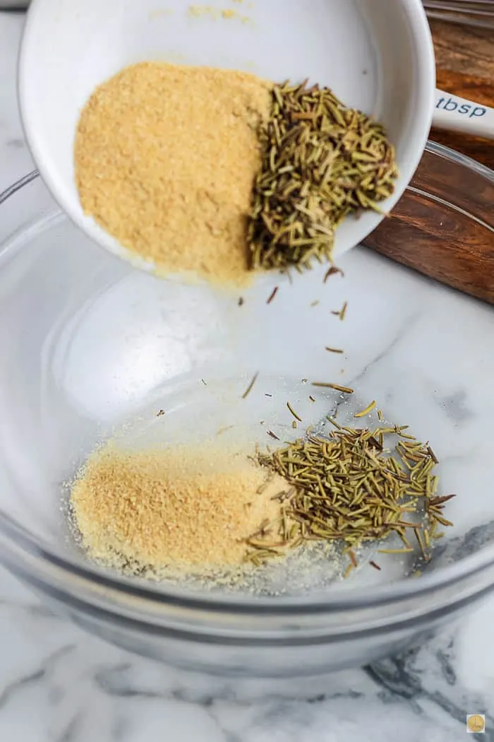 spices pouring into a clear bowl