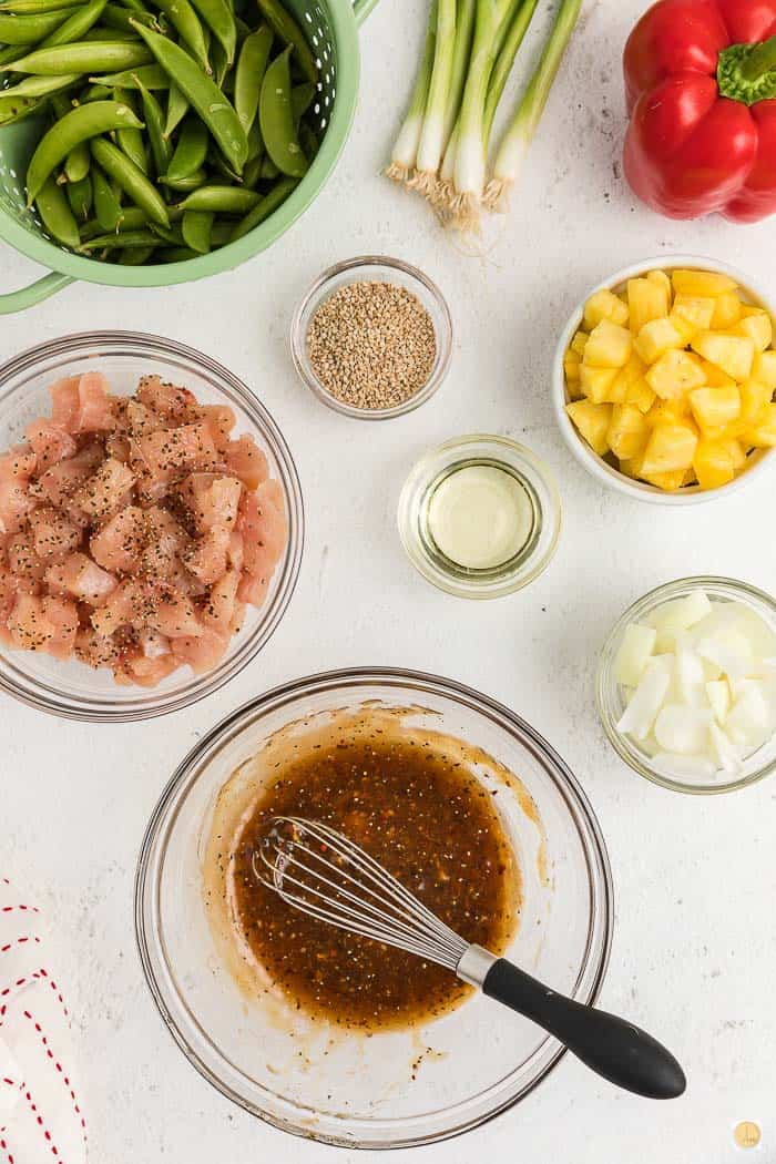 mixing marinade in a bowl with whisk