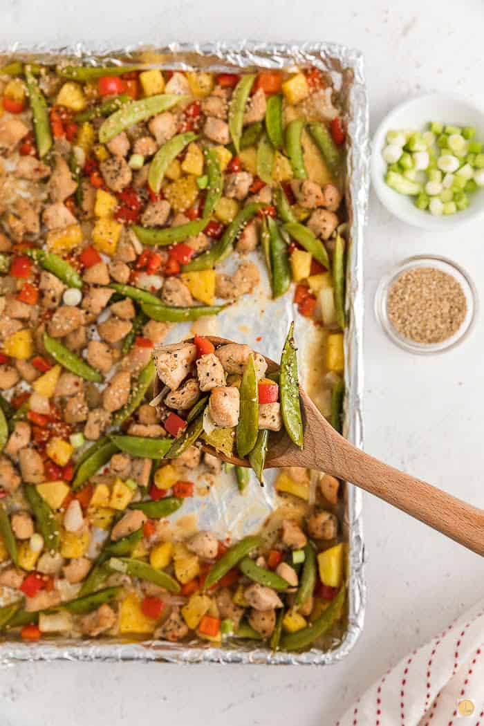 spoon scooping out chicken and vegetables