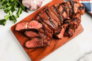 overhead picture of steak on a board