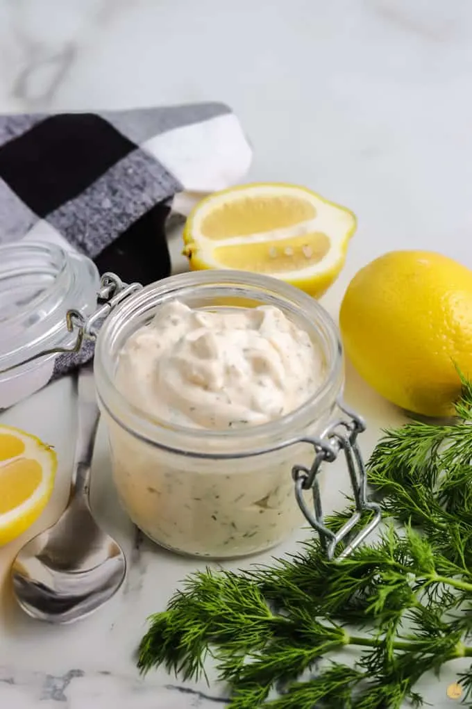 jar of sauce with lemons