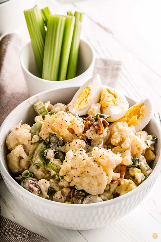 bowl of salad and celery