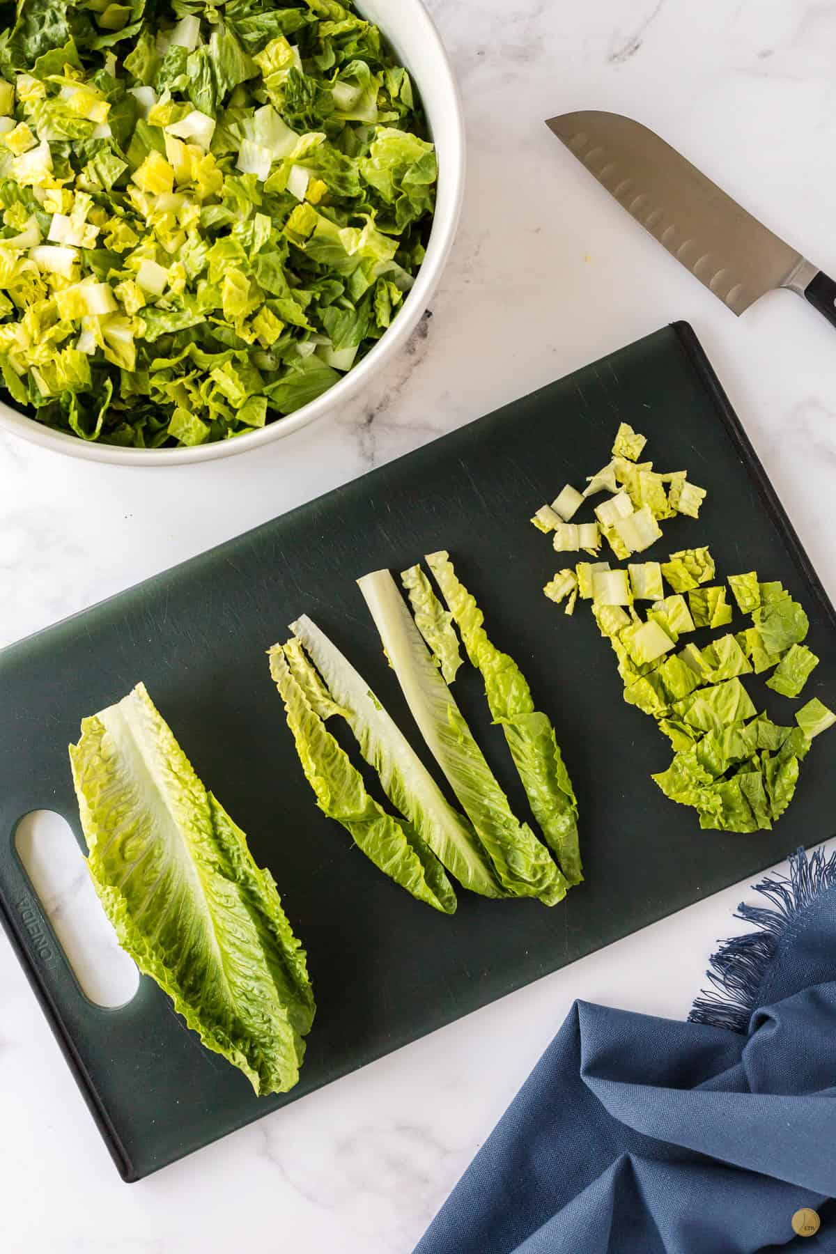chopped lettuce on a cutting board