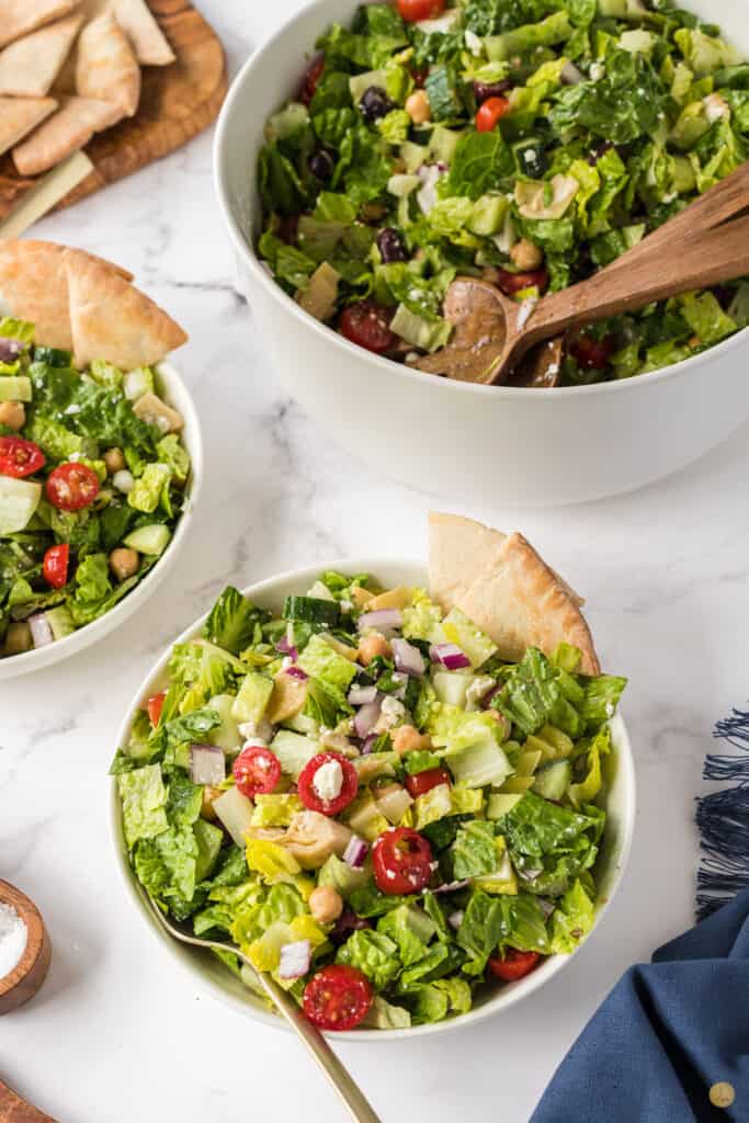 three bowls of salad