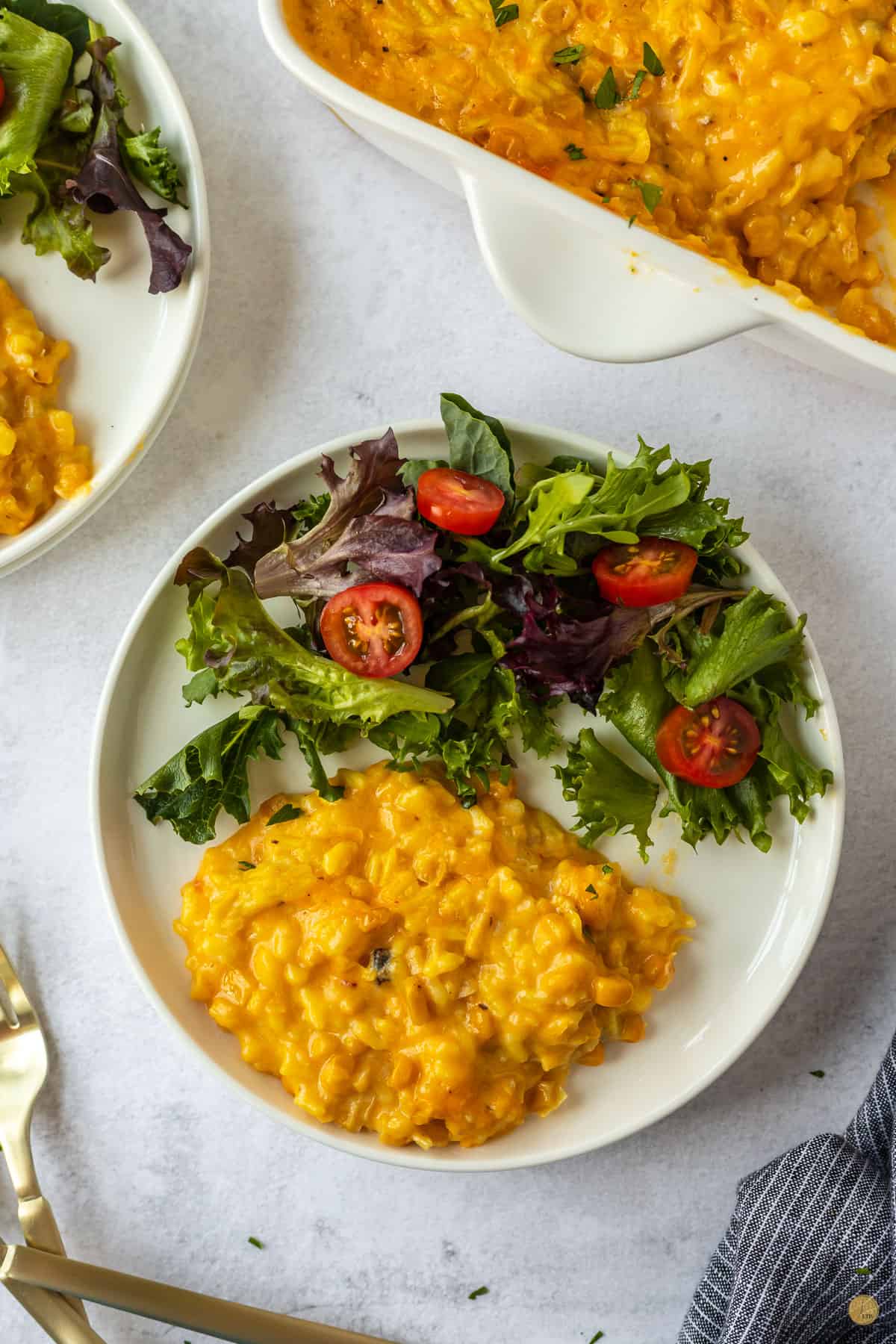 plate of salad and corn casserole