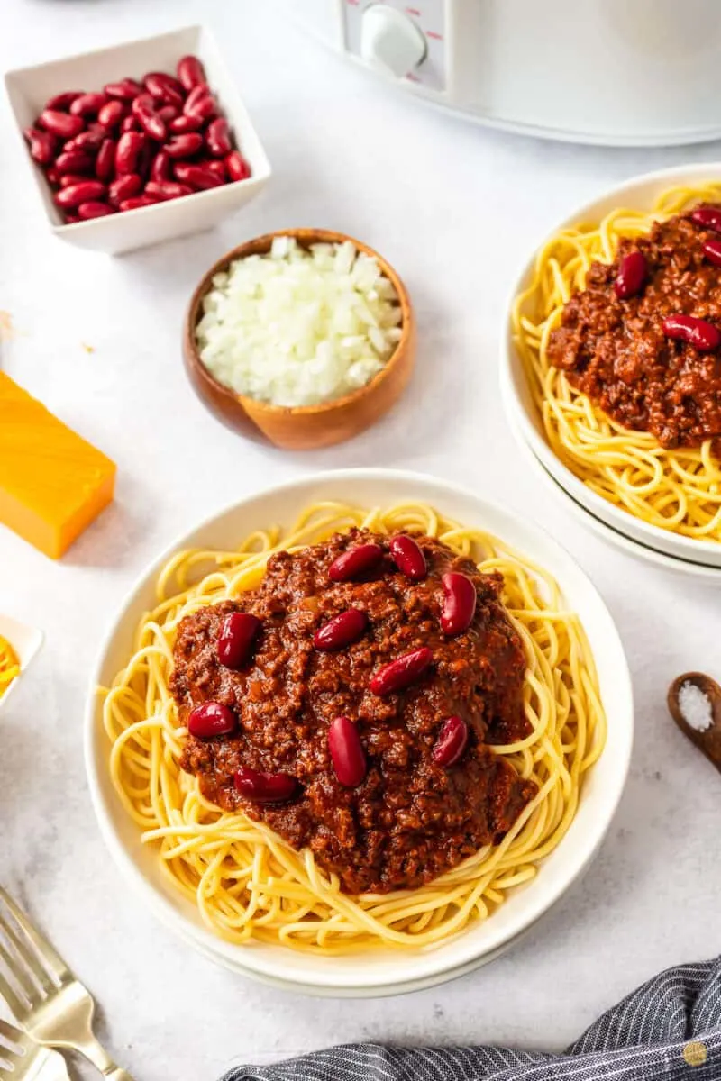 bowl of chili, spaghetti, and beans
