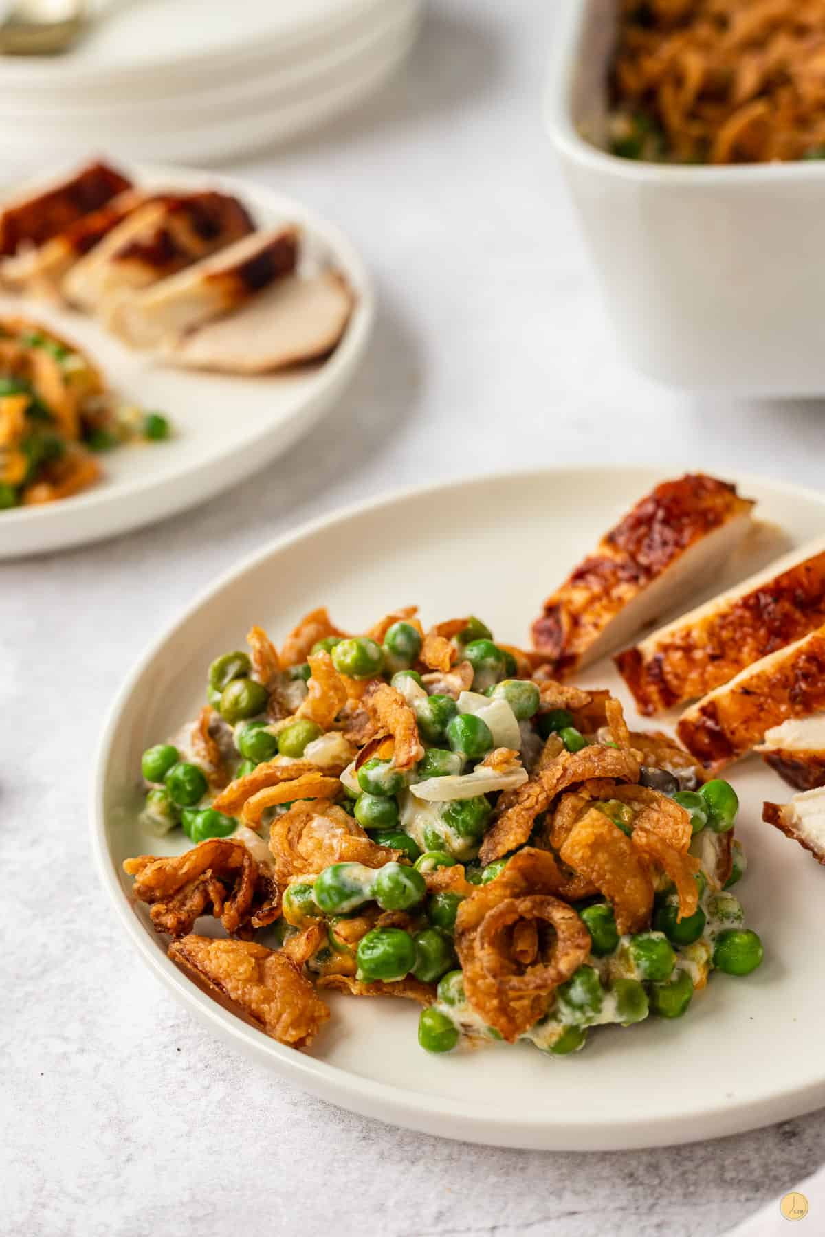 plate of casserole and chicken