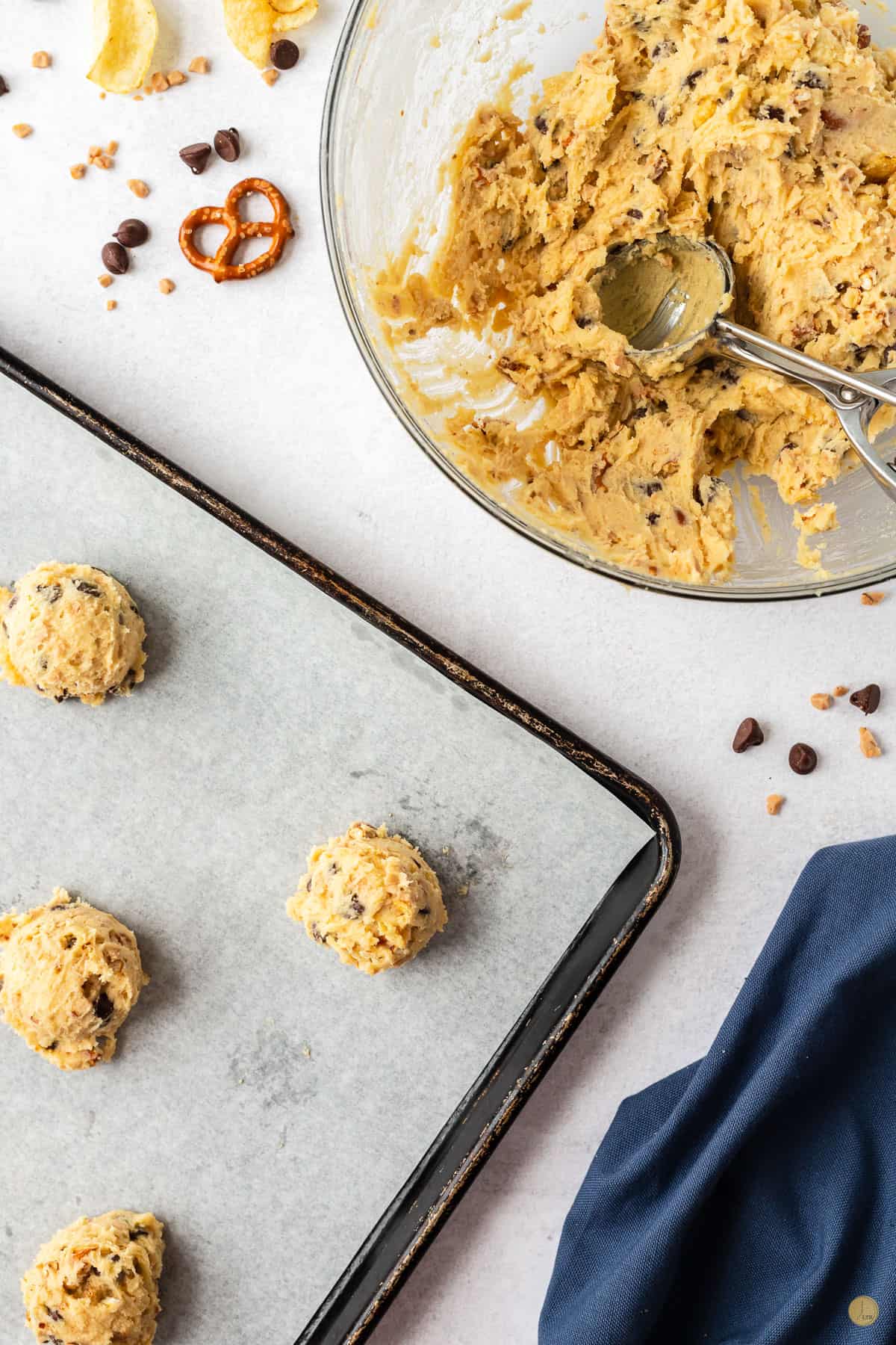 scoops of cookie dough on a cookie sheet