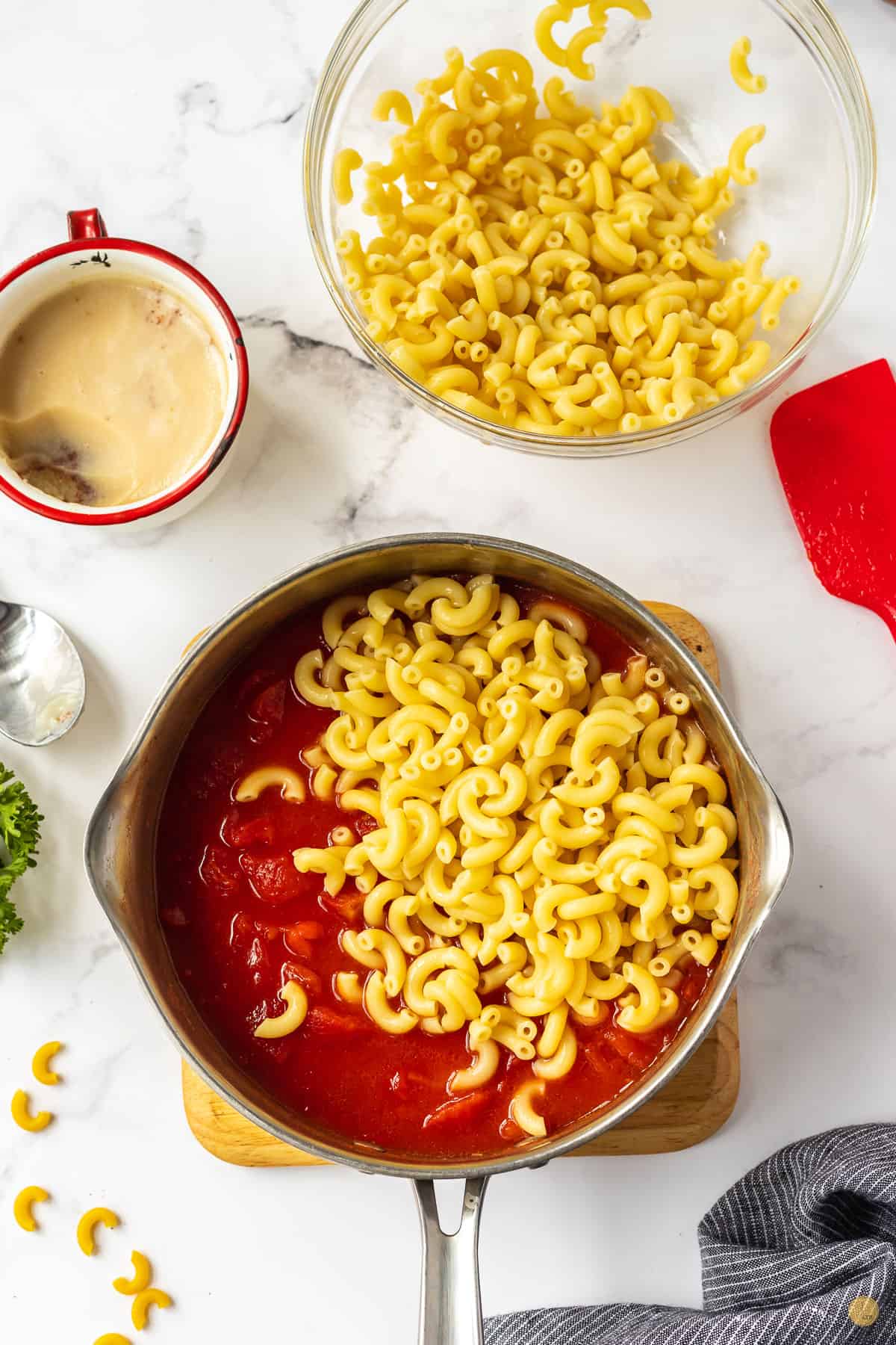tomatoes and noodles in a pot
