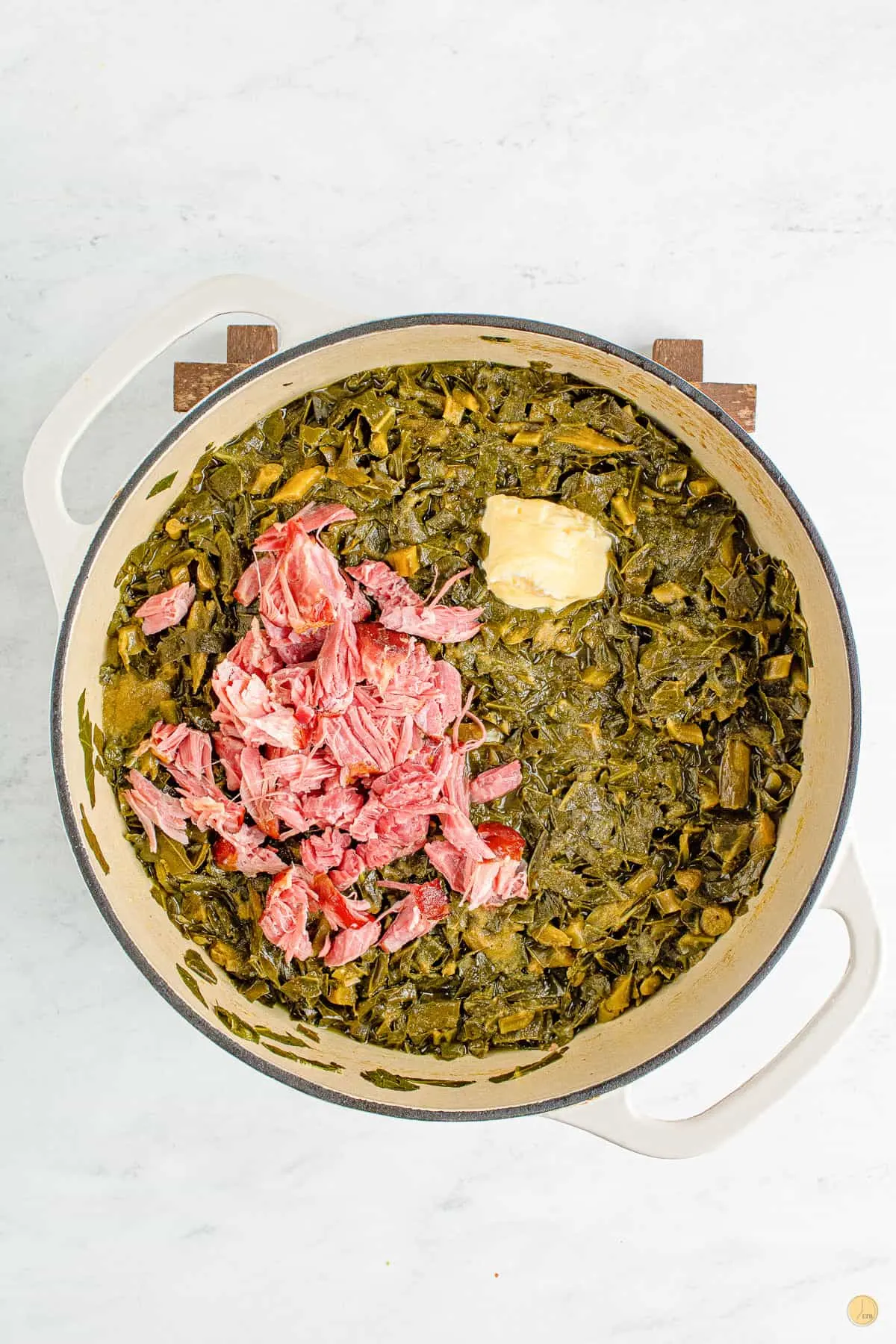 greens and ham in a pot