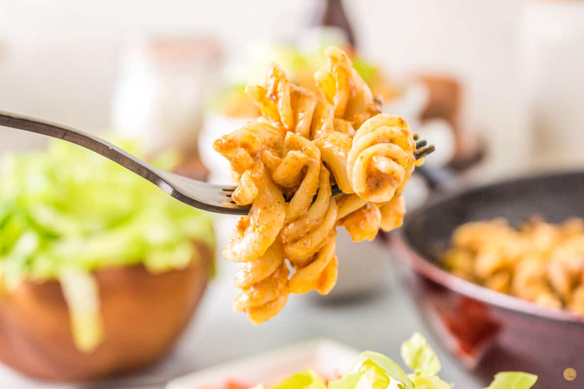 fork of pasta with mild salsa