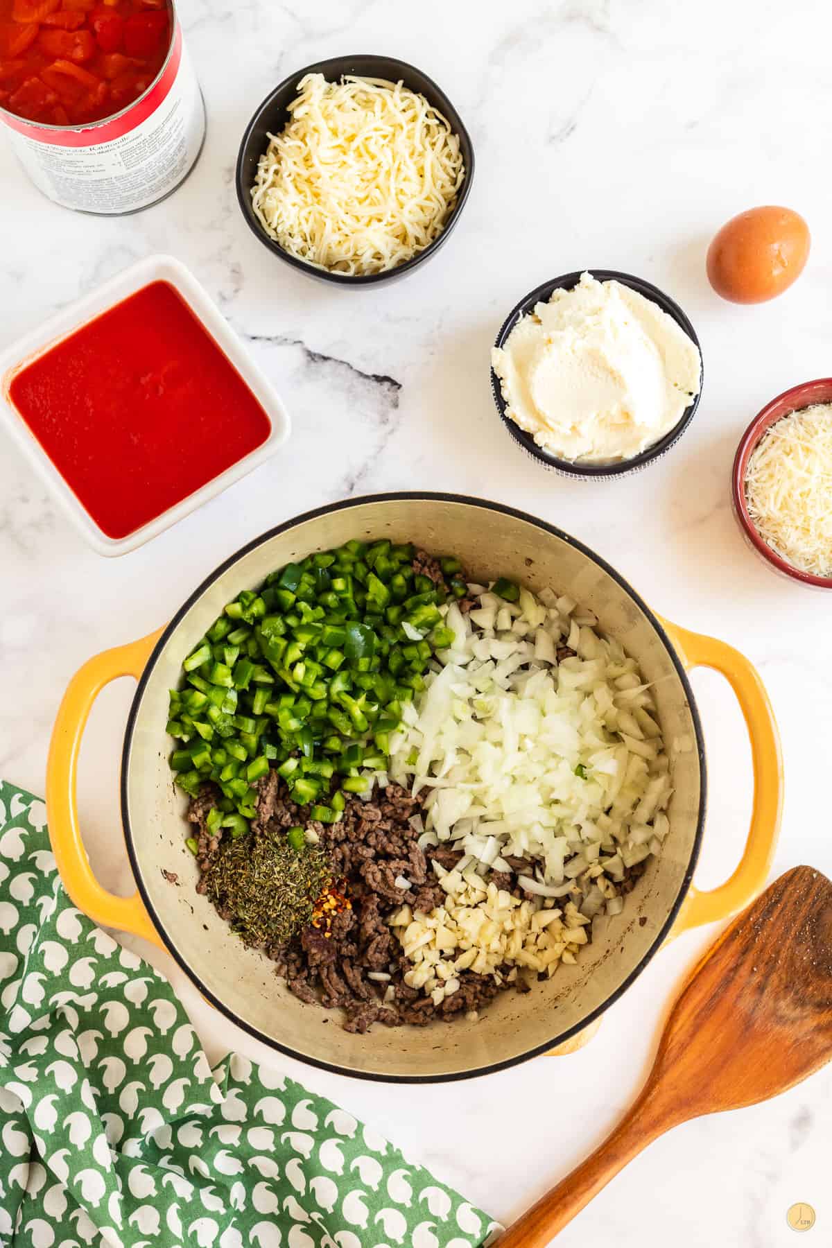 cook meat and veggies in a pot over medium-high heat