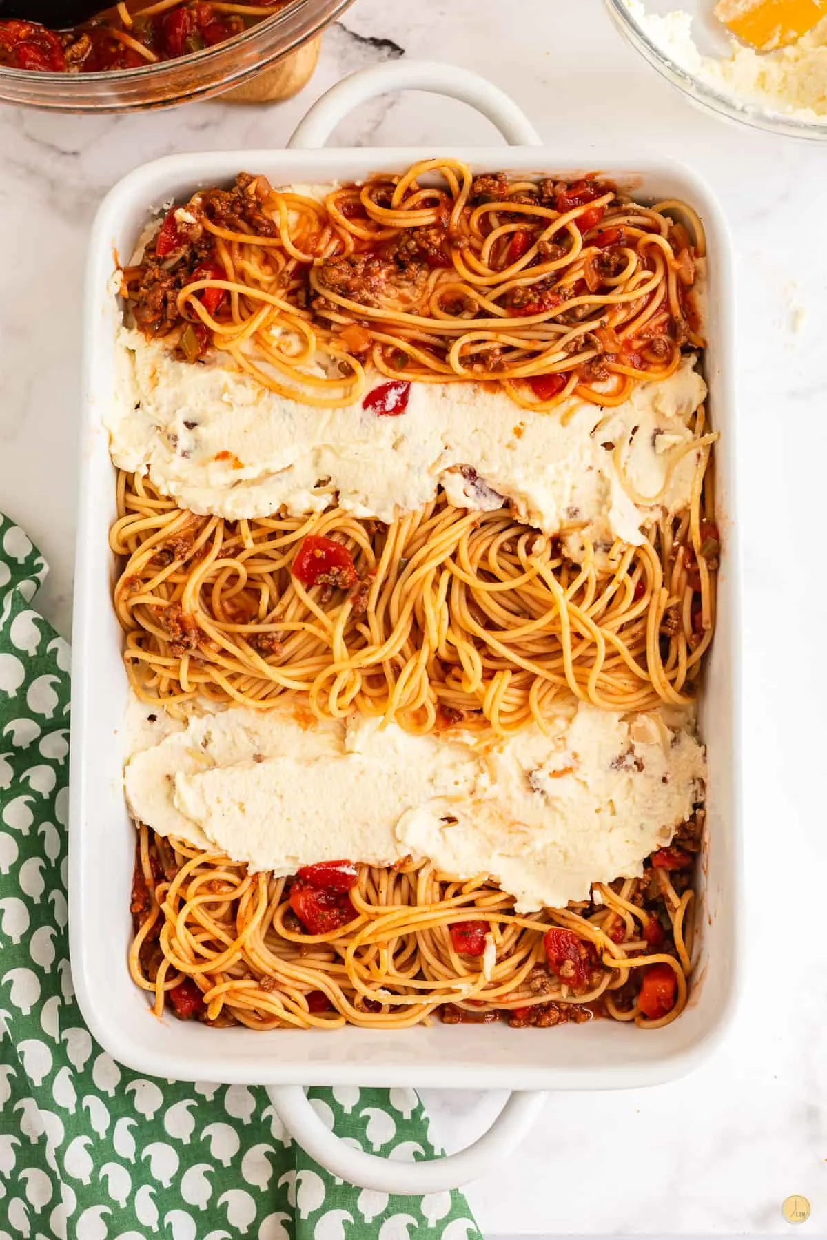 casserole dish with layers of pasta and cheese