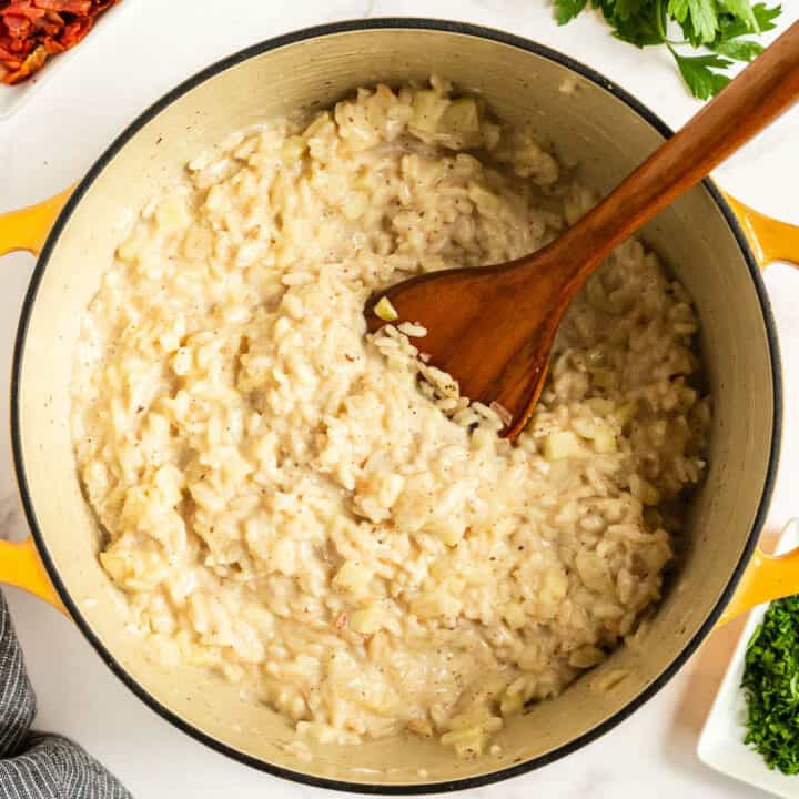 pot of risotto with wood spoon