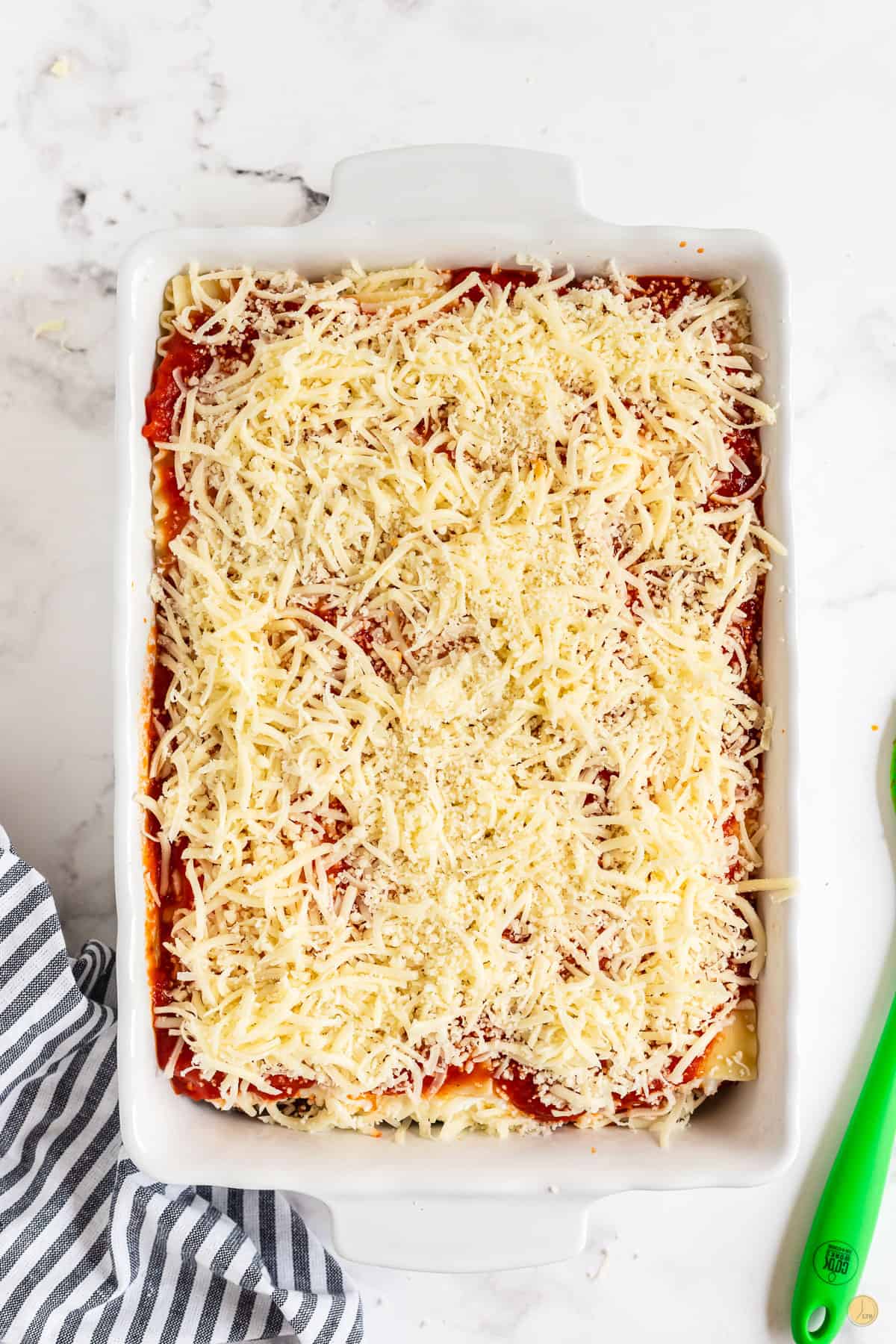 unbaked lasagna in a baking dish