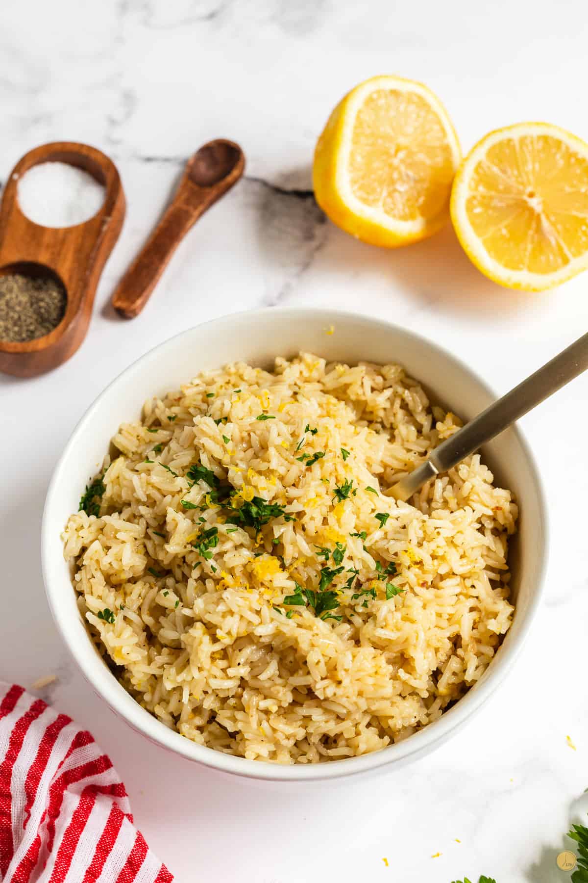 bowl of rice with a fork and red napkin