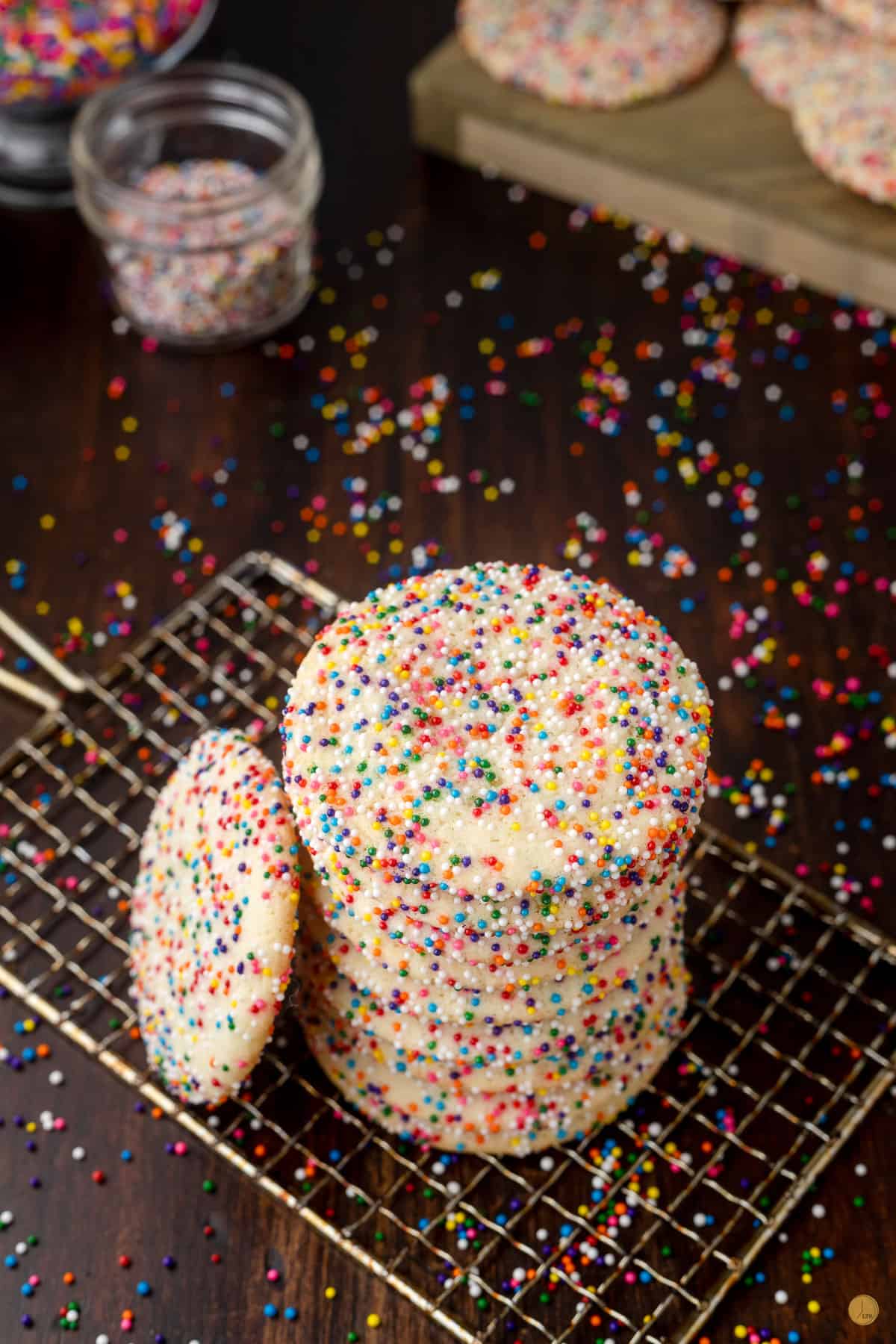 stack of sprinkle cookies on a wire rack