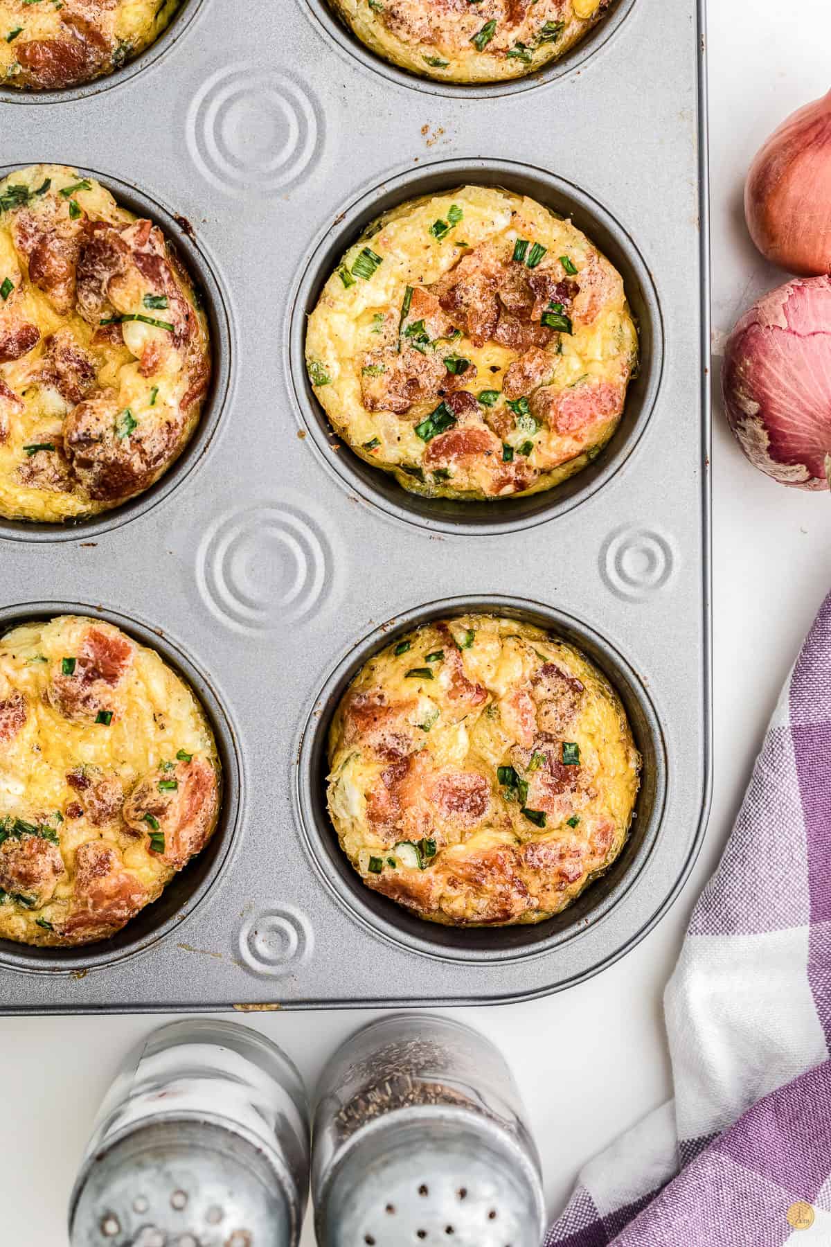 overhead view of muffin pan with eggs