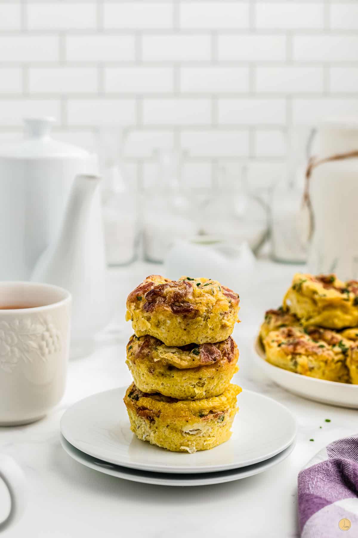 stack of egg muffins on a stack of plates