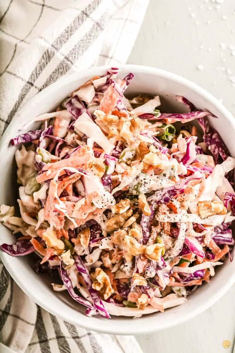 bowl of coleslaw served with meatballs
